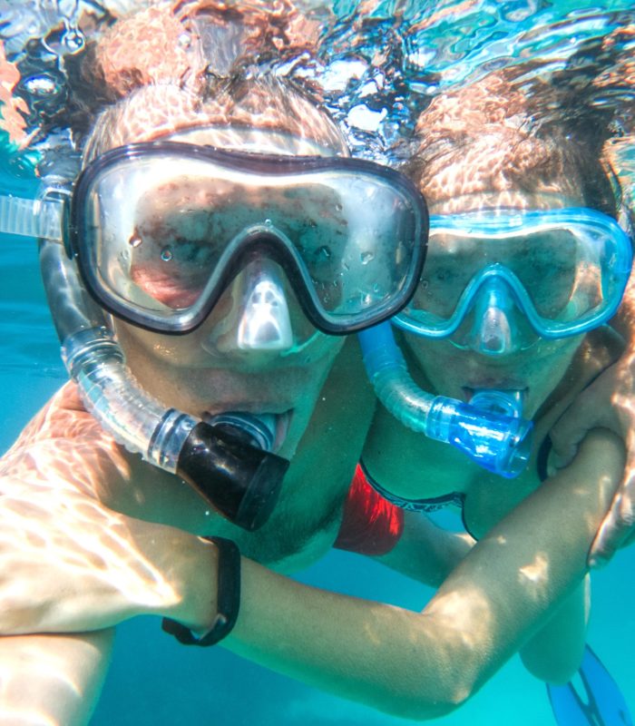 Underwater photo of a couple snorkeling in tropical sea